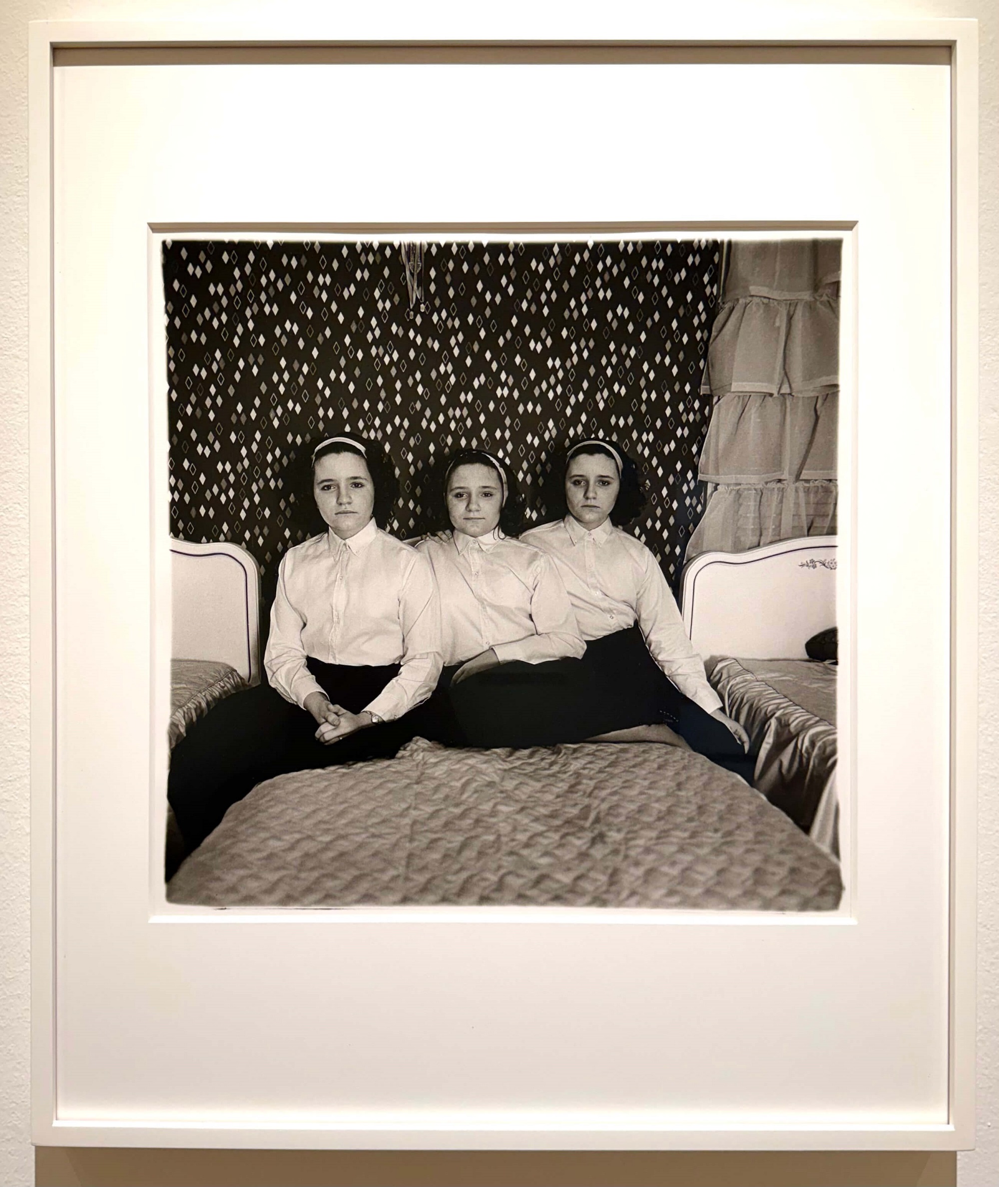 Diane Arbus. Triplets in their bedroom. N.J. 1963. Diane Arbus: Sanctum Sanctorum. Fraenkel Gallery, SF.