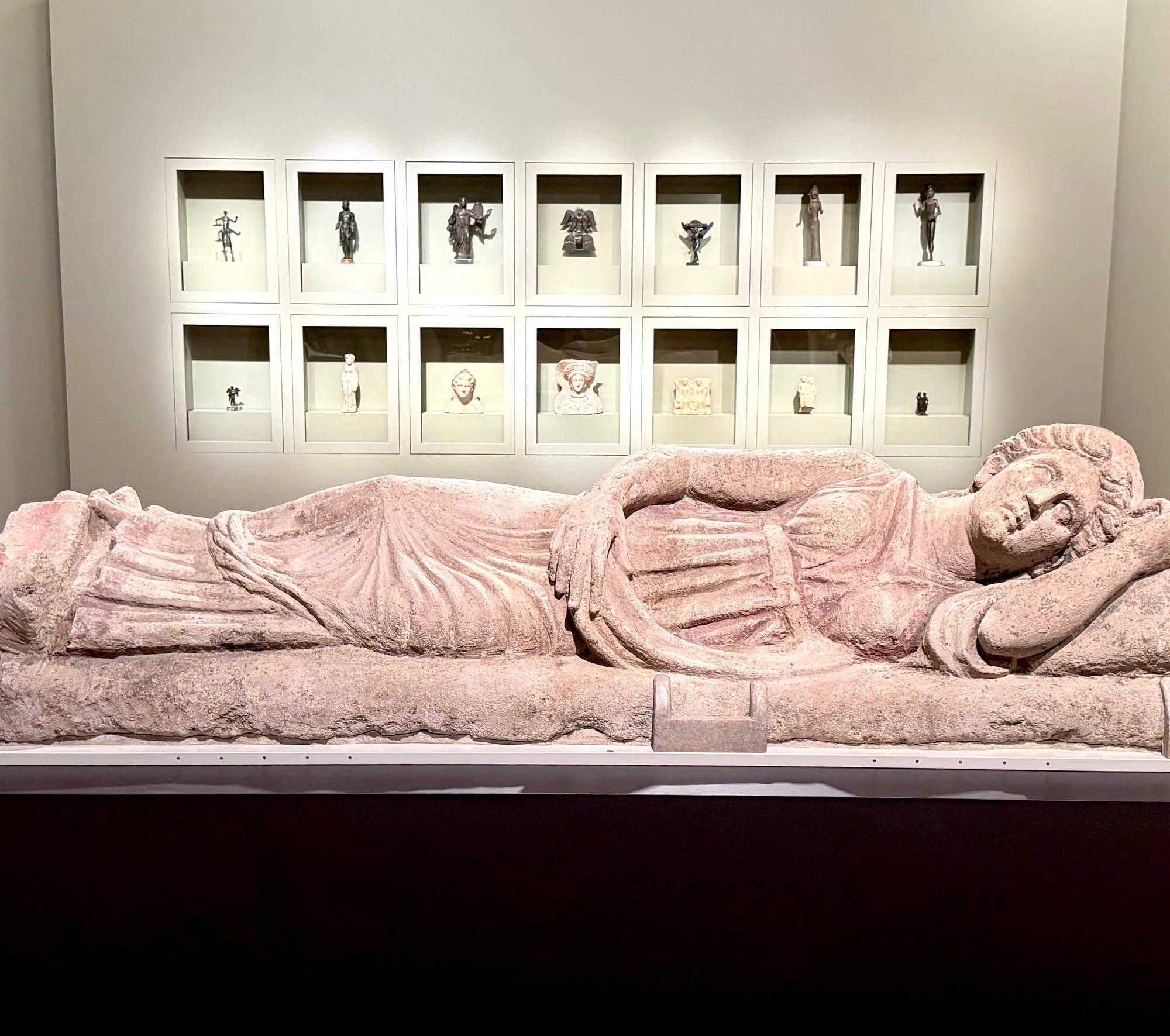 Etruscan sarcophagus lid with votive figures, including representation of deities. The Etruscans: From the Heart of Ancient Italy. Legion of Honor, SF.